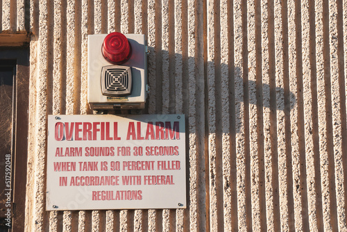 Industrial overfill alarm and sign