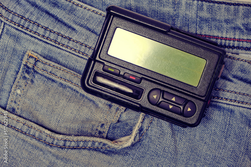 Pager is an old retro gadget for communication on jeans.