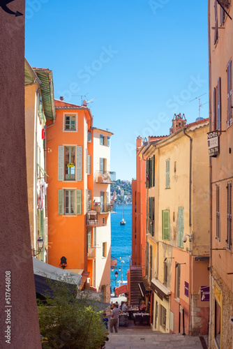 Villefranche-sur-Mer, France, September 2021. Old narrow authentic street of the city of Villefranche-sur-Mer in the French Riviera resort. Journey along the Cote d'Azur.