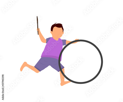 Boy playing with toy hoop by hands and hoop is rolling in ground. hoop racing game with a stick