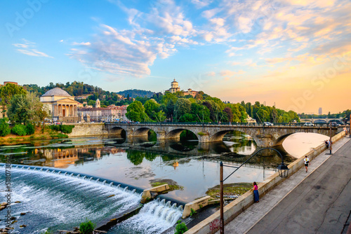 Turin, Italy. Panoramic view at sunset of the Po River, the Church of the Gran Madre, the Church of Monte dei Cappuccini and the Vittorio Emanuel I Bridge. July 13, 2022.