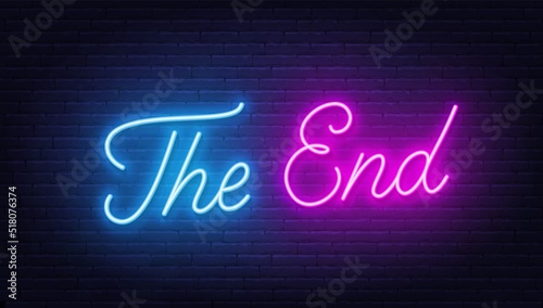 The end neon sign on brick wall background.