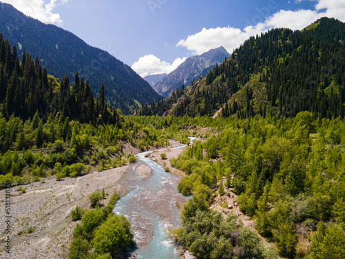 The Issyk River is above the lake. The valley of the mountain river is high in the mountains. Beautiful mountain landscape. Aerial photography of a mountain river.
