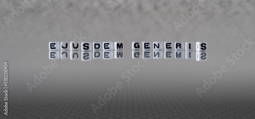 ejusdem generis word or concept represented by black and white letter cubes on a grey horizon background stretching to infinity