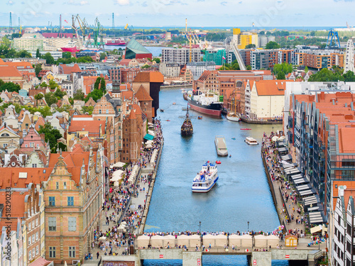 Tourist destination of Gdansk, old buildings in downtown by Motlawa river, aerial landscape