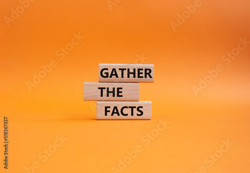 Gather the facts symbol. Wooden blocks with words Gather the facts. Beautiful orange background. Business and Gather the facts concept. Copy space.