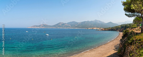 Beach with crystal clear azure sea and coastline on Corsica, France