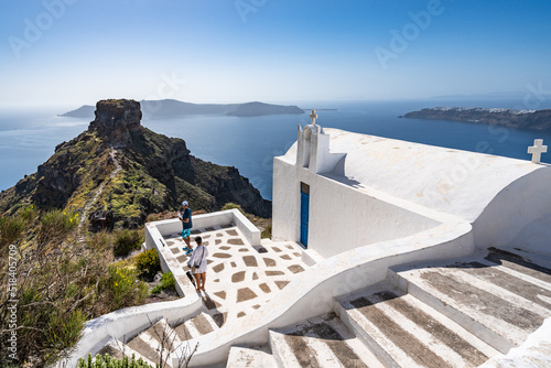 Traditional white Greek church with an amazing view over Skaros rock in Santorini, Greece