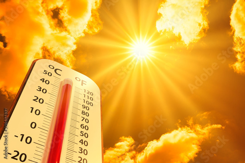 hot temperature,Thermometer on yellow sky with sun shining in summer show higher Weather, concept global warming