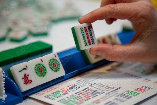 Holding a mahjong tile