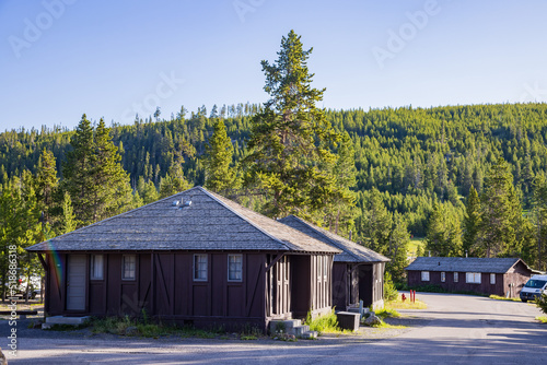 Sunny exterior view of the Old Faithful Lodge
