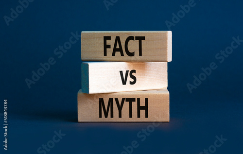 Fact vs myth symbol. Concept words Fact vs myth on wooden blocks on a beautiful grey table grey background. Business, finacial and fact vs myth concept. Copy space.