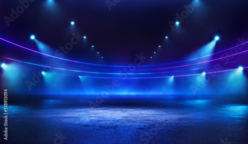 Grand blue neon digital stadium illuminated at night with spotlight empty space background on lawn. Copy space neon sports template