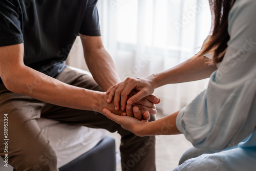 Young woman comforting and supporting a sad man who is in serious trouble at home, Consolation and encouragement concept