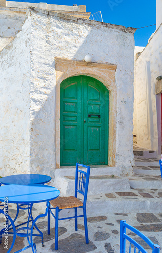 A wooden green colored door of a Beautiful traditional house in Chora the capital of Amorgos island in Greece