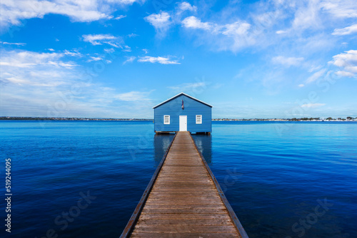 Charming blue boathouse at the end of a pier in Crawley, Western Australia