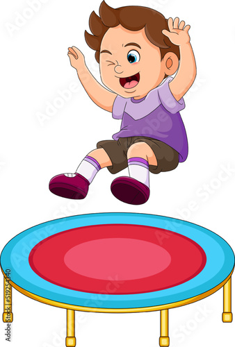 The happy boy is jumping on the trampoline and blinking the eyes