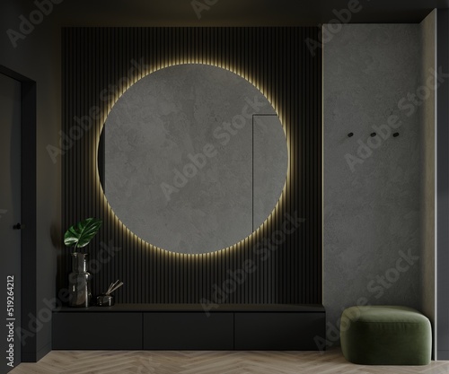Corridor or entrance area design in dark colors - black and gray. The accent is a large round mirror with warm illumination. Green pouf and drawers, coat hooks on the wall. 3d rendering