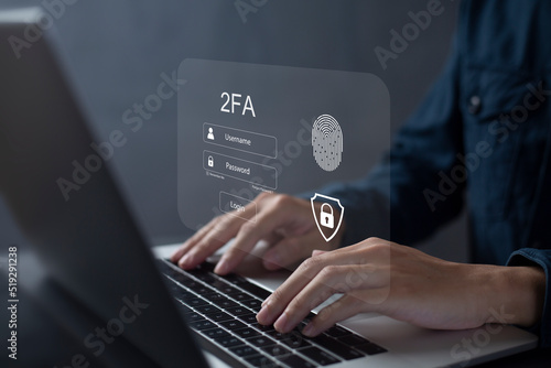 Person using laptop and touching virtual screen for two-factor authentication for safety use of social networks and access to information privacy