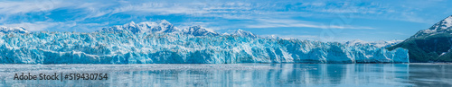 A panorama view of the ice wall of the snout of the Hubbard Glacier in Alaska in summertime