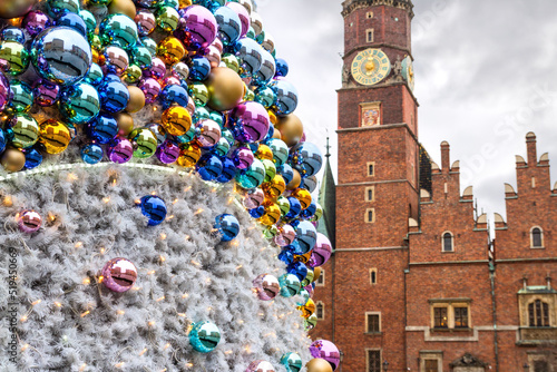 Christmas balls with reflected old city buildings, on the background of the Old Town Hall of Wroclaw (Stary Ratusz, Breslauer Rathaus), Poland