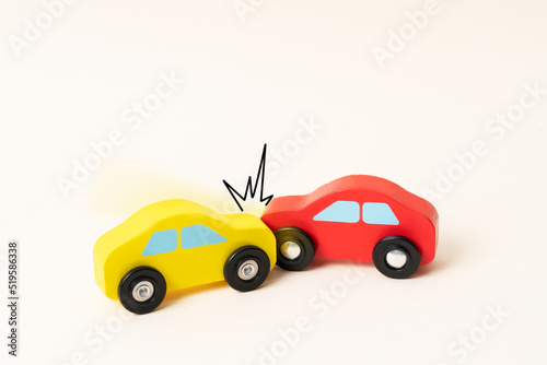 Two mini toy car crash with ambulance and police car. Toy car traffic, serious accident.