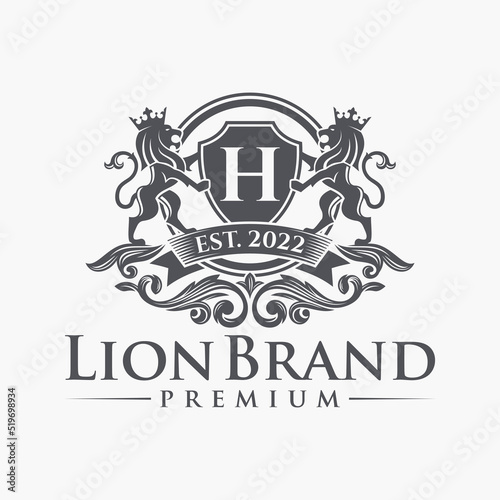 Luxury Lion crest heraldry logo. Elegant gold heraldic shield icon. Premium brand identity emblem. Royal coat of arms company label symbol. Modern vector illustration.