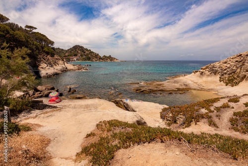 Spiaggia del Cottoncello, a free white sandy beach surrounded by smooth, white granite cliffs is perfect for snorkeling near Sant Andrea, Elba Island, Italy