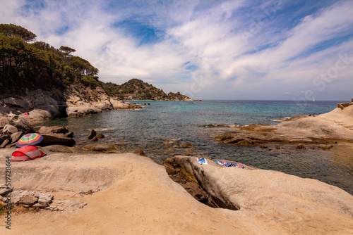 Spiaggia del Cottoncello, a free white sandy beach surrounded by smooth, white granite cliffs is perfect for snorkeling near Sant Andrea, Elba Island, Italy