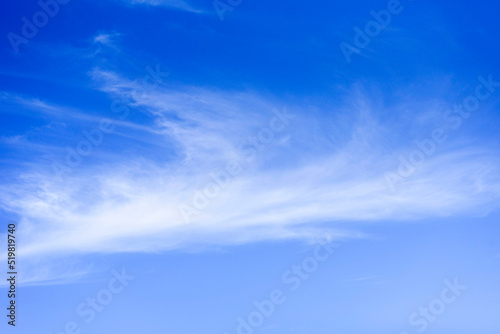 Summer blue sky with white clouds. Blue background with place for text.
