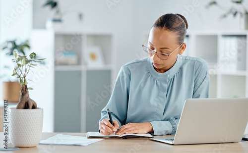 Serious, thinking and confident finance manager writing notes in notebook or book in office. Financial boss planning, arranging and scheduling deadlines for tax or calculating business profit or loss