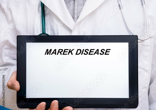 Marek Disease. Doctor with rare or orphan disease text on tablet screen Marek Disease