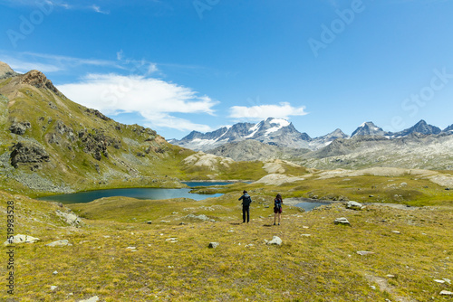 Excursion on the Gran Paradiso in the Alps. Walk in immense valleys and very high peaks above 3000m. Glacial lakes with crystal clear water and green meadows. The peaks crowned by huge rocks.