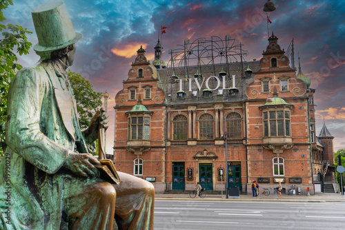 Hans Christian Andersen statue and Tivoli building facade, built in 1843. Entrance to Tivoli Garden, one of the oldest operating amusement parks in the world. Copenhagen - Denmark