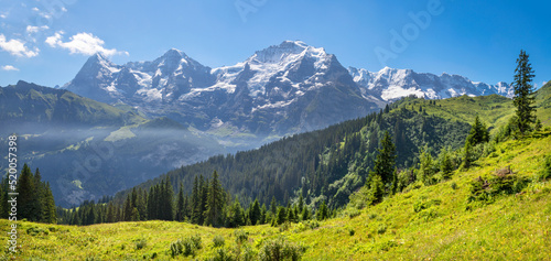 The panorma of Bernese alps with the Jungfrau, Monch and Eiger peaks.