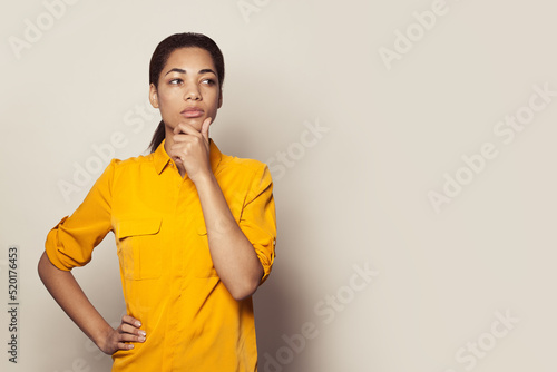 Black African American woman thinking on white background Thinking or brainstorming concept