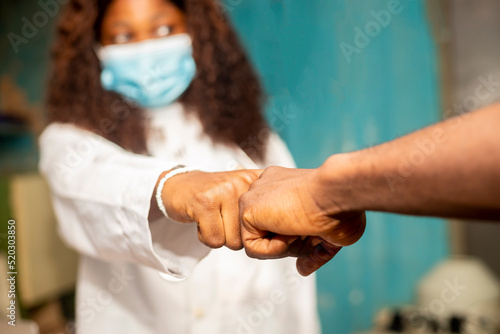 female Doctor giving fist bump with patient in hospital.healthcare and medicine