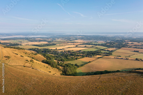 Glorious aerial drone landscape image of South Downs in English countryside on Summer morning