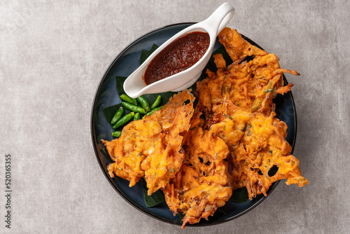 Bakwan is a vegetable fritter or gorengan from Indonesian cuisine.The ingredients are vegetables, usually beansprouts, shredded cabbages and carrots, battered and deep fried in cooking oil.