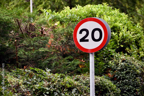 Road sign showing a 20 mph speed limit at the approach to a residential area