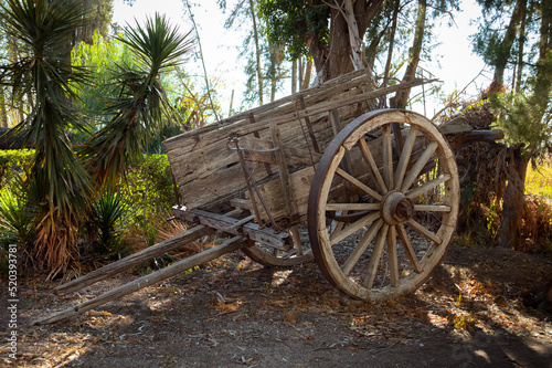 An old wagon abandoned in the field.