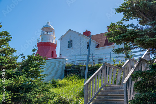 The lighthouse at Crow Head near Twillingate, Newfoundland acts as a beacon for boaters in the Labrador Sea.