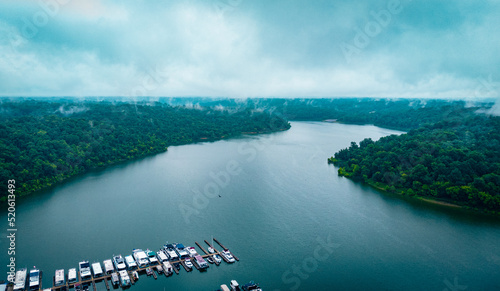 Casted in blue Tailorsville Lake in central Kentucky. Private boats parked on a marina on the bottom part of the image.