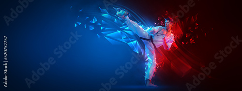 Collage with active young man, karate fighter in white kimono in action, motion isolated on blue-red background with neoned elements. Sport, ad concept