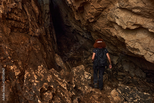 Woman explorer in a cave