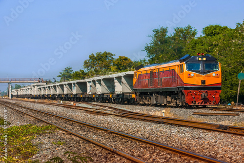 Freight train by diesel locomotive on the railway