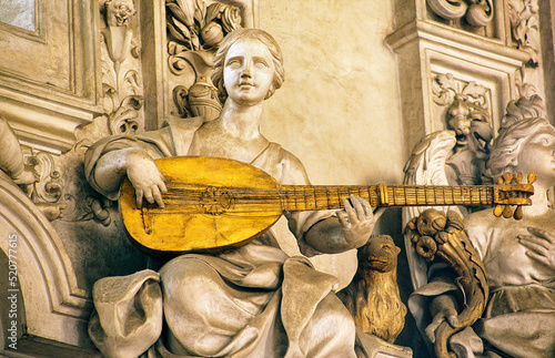 Detail in the Oratorio del Rosario di Santa Zita, Palermo, Sicily, Italy. Stucco work by Giacomo Serpotta. Woman playing lute
