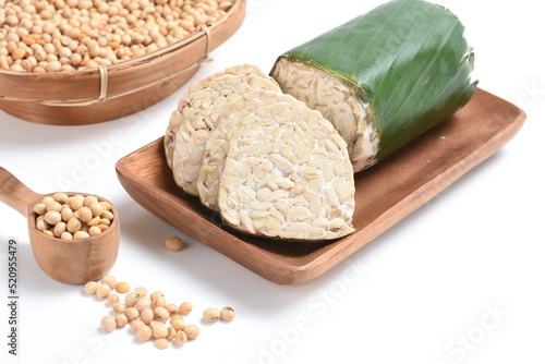 tempeh Indonesian traditional food made from fermented soybeans. They are usually wrapped in banana leaves.