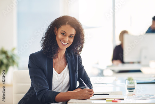 Confident and smiling portrait of a businesswoman, marketing executive or corporate worker working, writing and planning schedule in notebook at an office. Face of a happy administrator brainstorming