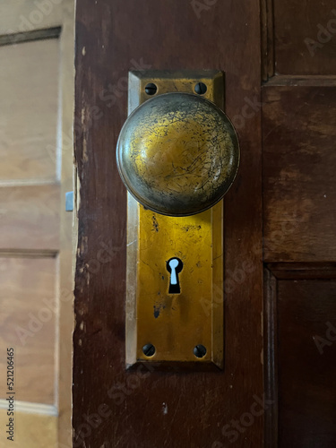 Old vintage brass doorknob with keyhole straight